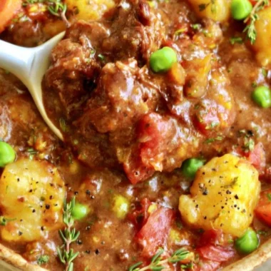 Hearty vegan gnocchi stew with fresh vegetables in a bowl