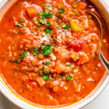 Bowl of Mediterranean Lentil Soup garnished with fresh herbs