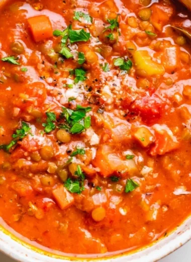 Bowl of Mediterranean Lentil Soup garnished with fresh herbs