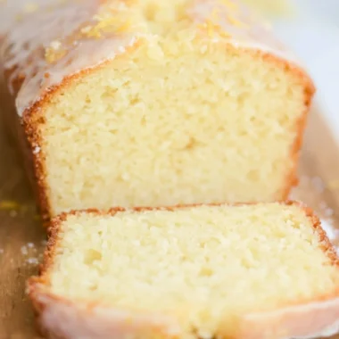 Sourdough Discard Lemon Cake topped with lemon glaze and fresh zest