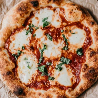 Homemade sourdough pizza crust topped with fresh ingredients