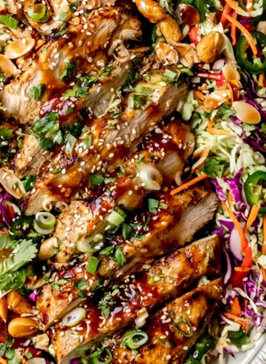 Delicious Honey Sriracha Salmon bowl with cabbage slaw and chicken salad.